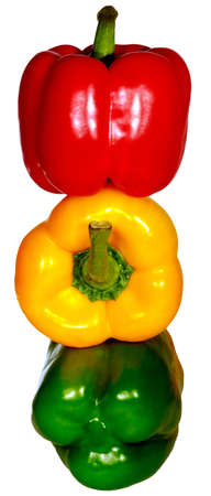 Isolated image of yellow, green and red peppers on a white backgroundの写真素材