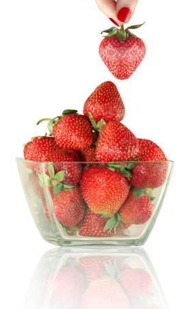 Isolated image of hand with strawberries and a bowl of strawberriesの写真素材