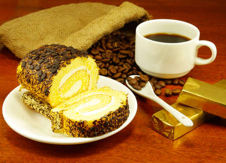 isolated  image of a cup of coffee, roll, chocolate and coffee beansの写真素材