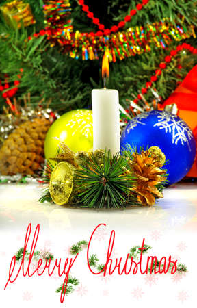 candle on a Christmas tree background closeupの写真素材