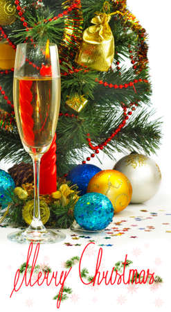 glass of champagne, Christmas toys and Christmas treeの写真素材