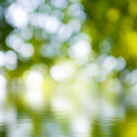 image of water surface on blurred green background の写真素材