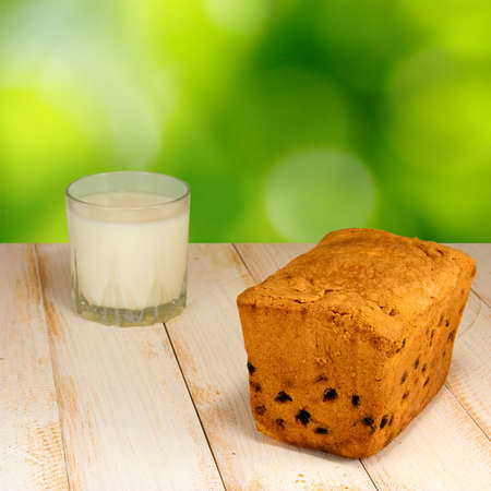 image of a glass of milk and cakeの写真素材