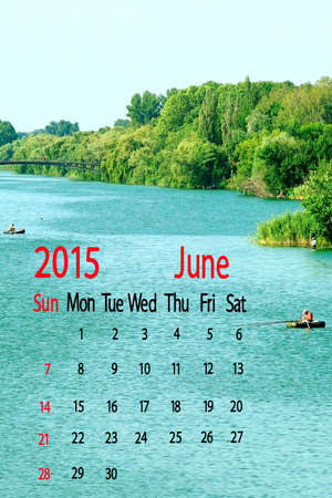 2015 Calendar. June. Boats on the water surrounded by treesの写真素材