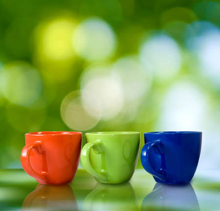 image of three cups on a green backgroundの写真素材