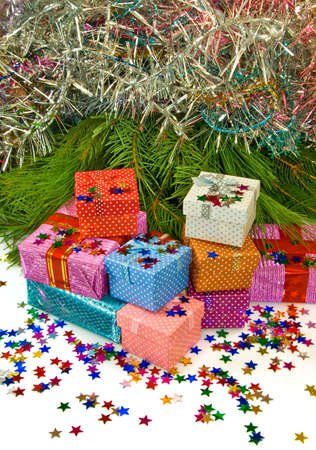image of many gift boxes on a fir branches backgroundの写真素材