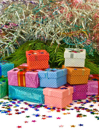 image of many gift boxes on a fir branches background closeupの写真素材