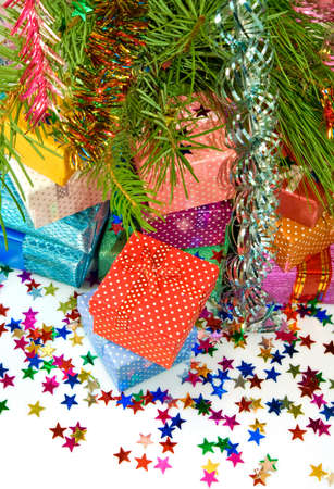 many gift boxes on a fir branches backgroundの写真素材
