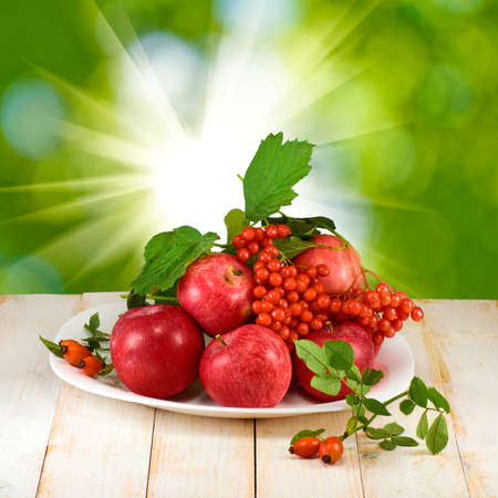 apples and berries on the table closeupの写真素材