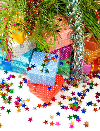 many colorful gift boxes on  fir branches backgroundの写真素材