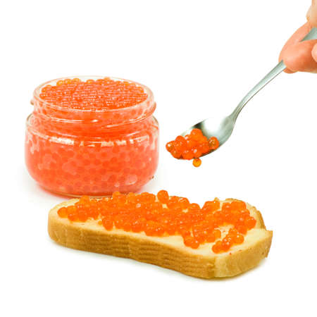 Isolated image of jars with red caviar and bread with red caviarの写真素材