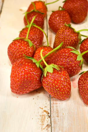 ripe and sweet strawberries on wooden table closeupの写真素材