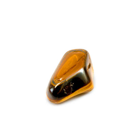 Isolated image of tiger eye stone on a white backgroundの写真素材