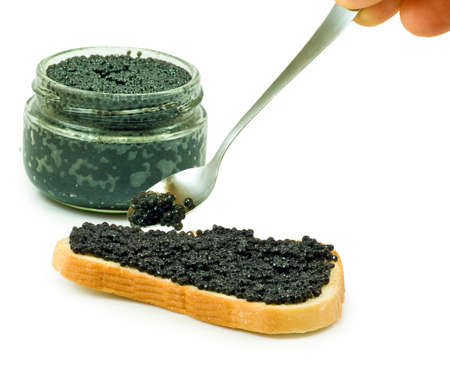 Isolated image of jars with black caviar and bread with black caviarの写真素材