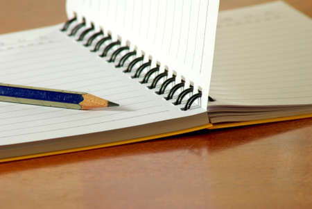 image of notebook and pencil closeupの写真素材