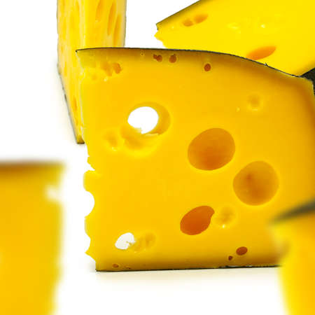 Isolated image of a piece of cheese on white backgroundの写真素材