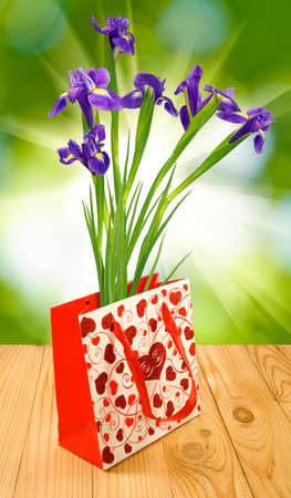 flowers in gift packing on a green backgroundの写真素材