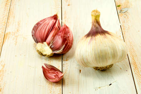 image of two  garlic on the tableの写真素材