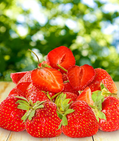 image of  strawberries on a green backgroundの写真素材
