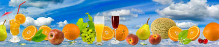 image of different fruits on a background of the skyの写真素材