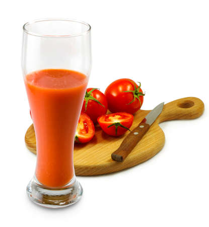 Isolated image of tomatoes and a glass of juice on a white backgroundの写真素材