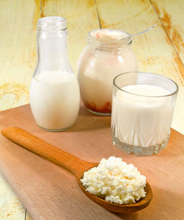 image of dairy products on a wooden boardの写真素材