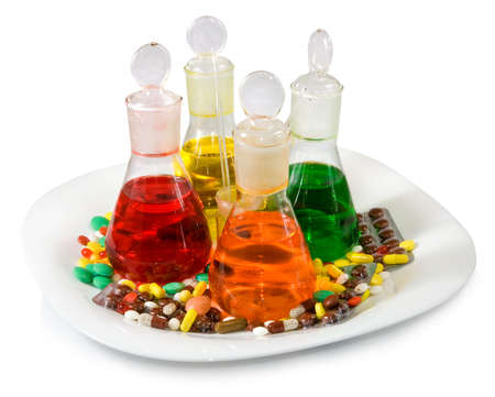 image of flasks with colored liquid and pills on white backgroundの写真素材