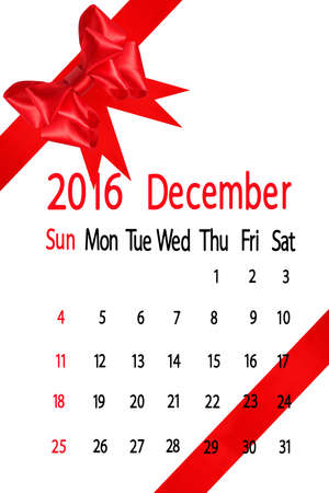calendar for the month of december on red bow backgroundの写真素材