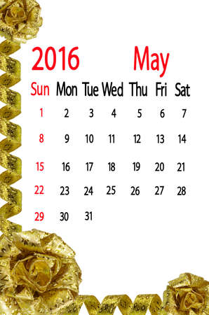 calendar for the month of may on yellow bow backgroundの写真素材