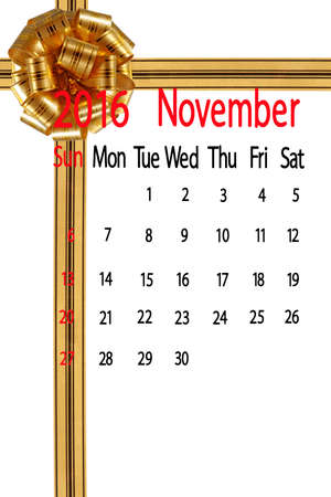 calendar for the month of november on yellow bow backgroundの写真素材
