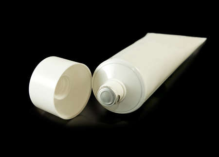 Isolated image of a tube of toothpaste on a black backgroundの写真素材