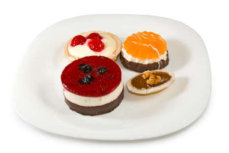 Image of different delicious cakes on a plate closeupの写真素材