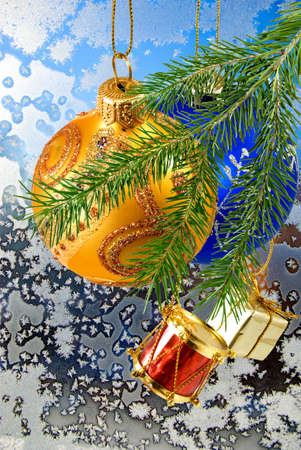 Christmas decorations on window frost background closeupの写真素材