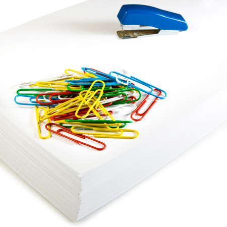 stacks of paper, stapler and clips closeup