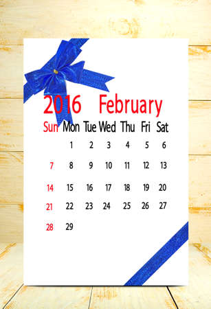 calendar for the month of February on wooden boards background closeupの写真素材