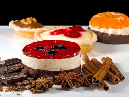 different delicious cakes on a black backgroundの写真素材