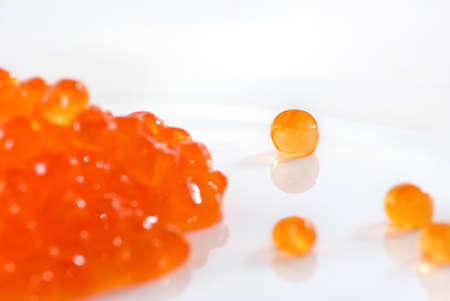 Isolated image of red caviar on a white background closeupの写真素材