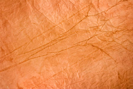Image of crumpled orange paper close-upの写真素材