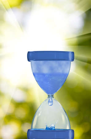 hourglass against the sky close-upの写真素材