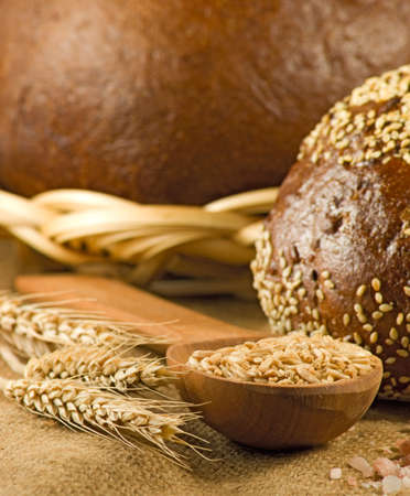 image of bread and wheat in spoon closeup