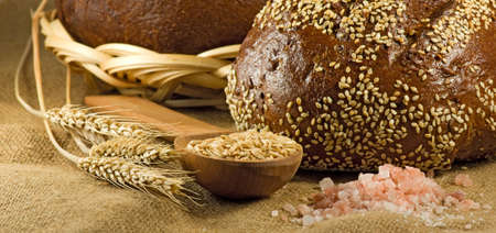 image of bread and wheat in spoon closeupの写真素材