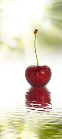 image of one cherry in the water closeupの写真素材
