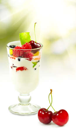 isolated image of yogurt in a glass with fruit on a white background closeupの写真素材