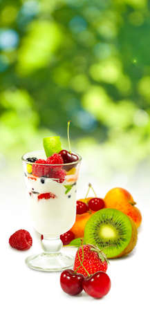 isolated image of yogurt in a glass with fruit on a white background closeupの写真素材