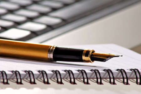 image of pen on keyboard background close upの写真素材