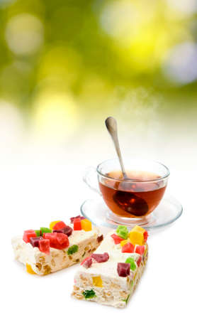 image of cups with tea and cookies on sunlight background close upの写真素材