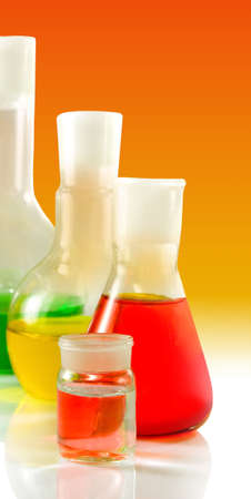 microscope and flasks with liquid in laboratory close-up