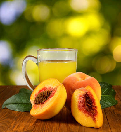 image of juice and peaches on the table closeupの写真素材