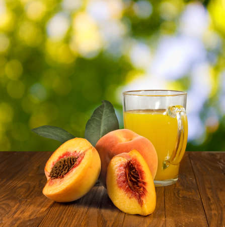 image of juice and peaches on the table closeupの写真素材