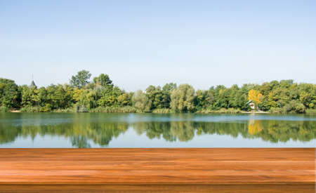 Image of wooden board on trees and rivers backgroundの写真素材